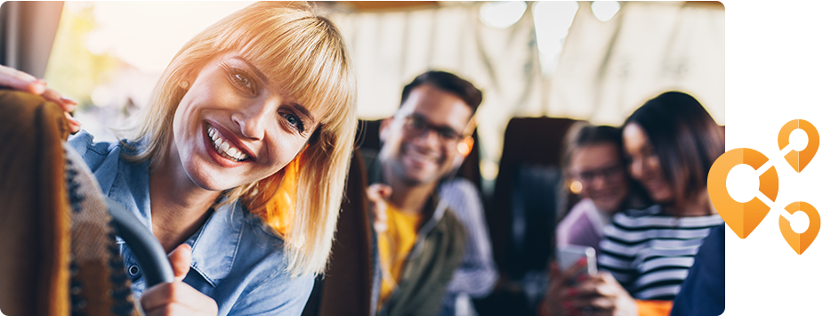 Woman smiling on a Reagan Mass Transit District bus