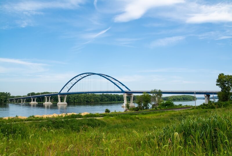 Arched bridge over Illinois river in northern Illinois landscape